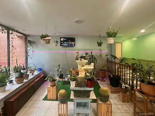 a room with lots of chairs and flower