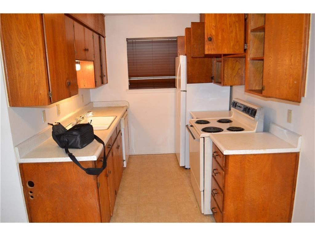 1107 North Locust Street, Unit 2 Denton, TX 76201 - Photo 5 of 8 a utility room with dryer and washer