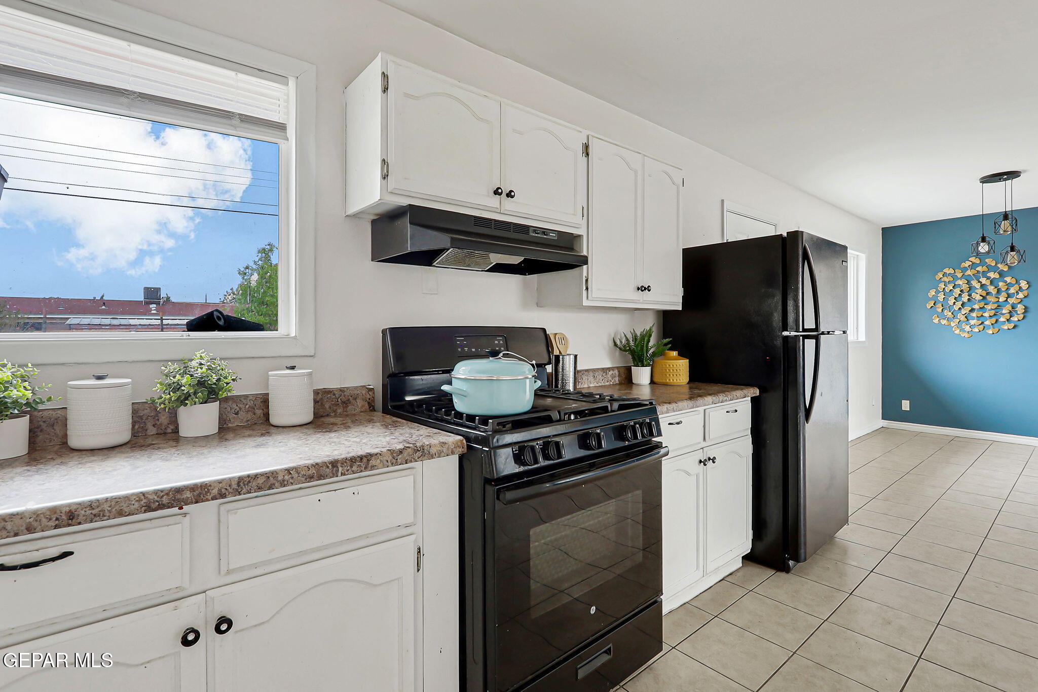 4956 Rutherford Drive El Paso, TX 79924 - Photo 13 of 41 a kitchen with granite countertop cabinets and steel stainless steel appliances