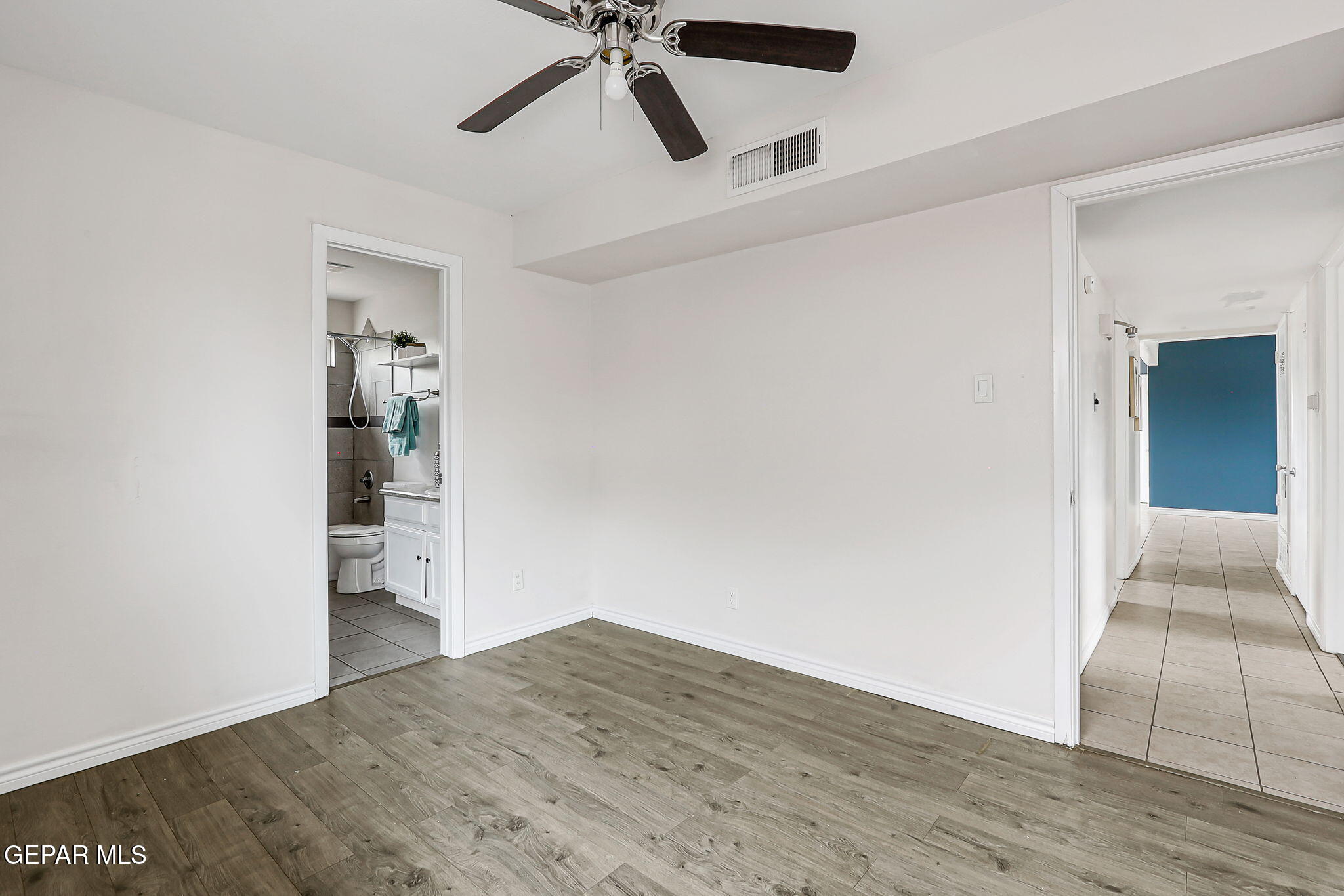 4956 Rutherford Drive El Paso, TX 79924 - Photo 17 of 41 wooden floor in an empty room