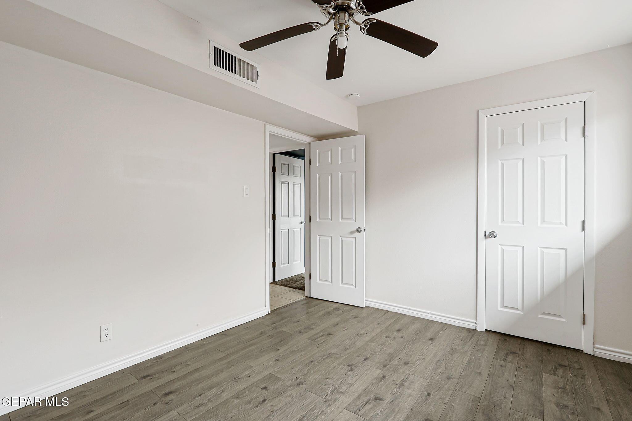 4956 Rutherford Drive El Paso, TX 79924 - Photo 18 of 41 wooden floor in an empty room