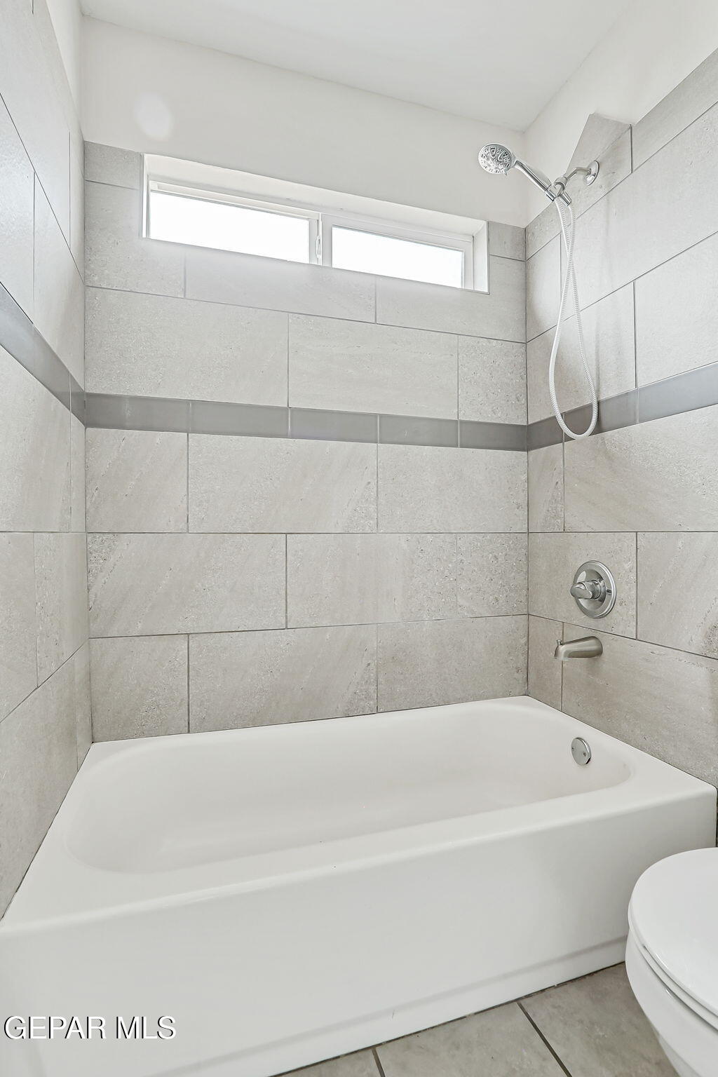 4956 Rutherford Drive El Paso, TX 79924 - Photo 21 of 41 a bathroom with a bathtub and a shower