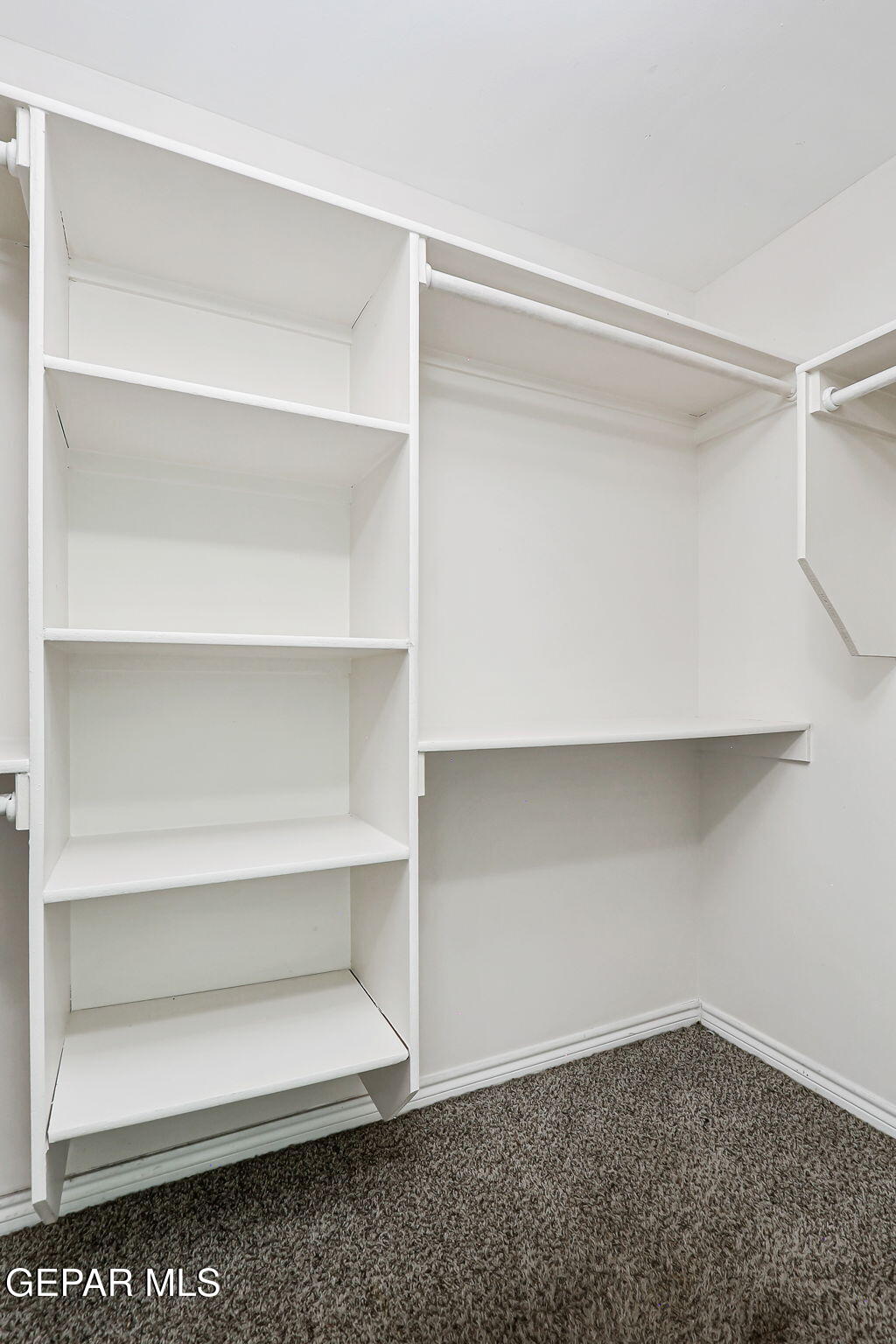 4956 Rutherford Drive El Paso, TX 79924 - Photo 22 of 41 a view of an empty walk in closet