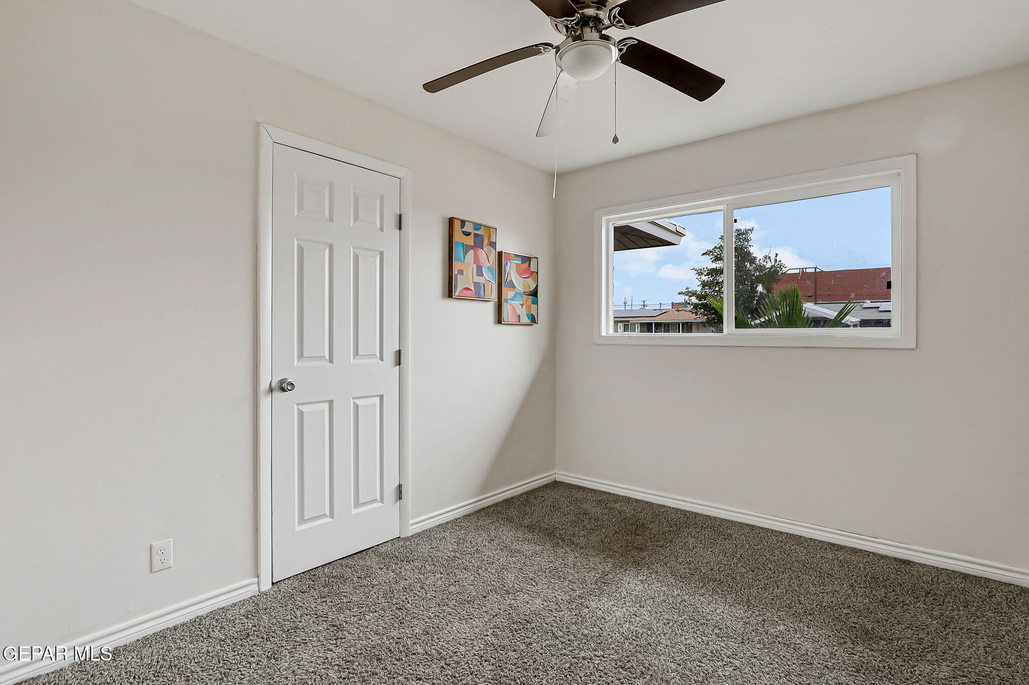 4956 Rutherford Drive El Paso, TX 79924 - Photo 23 of 41 en empty room with window and a ceiling fan