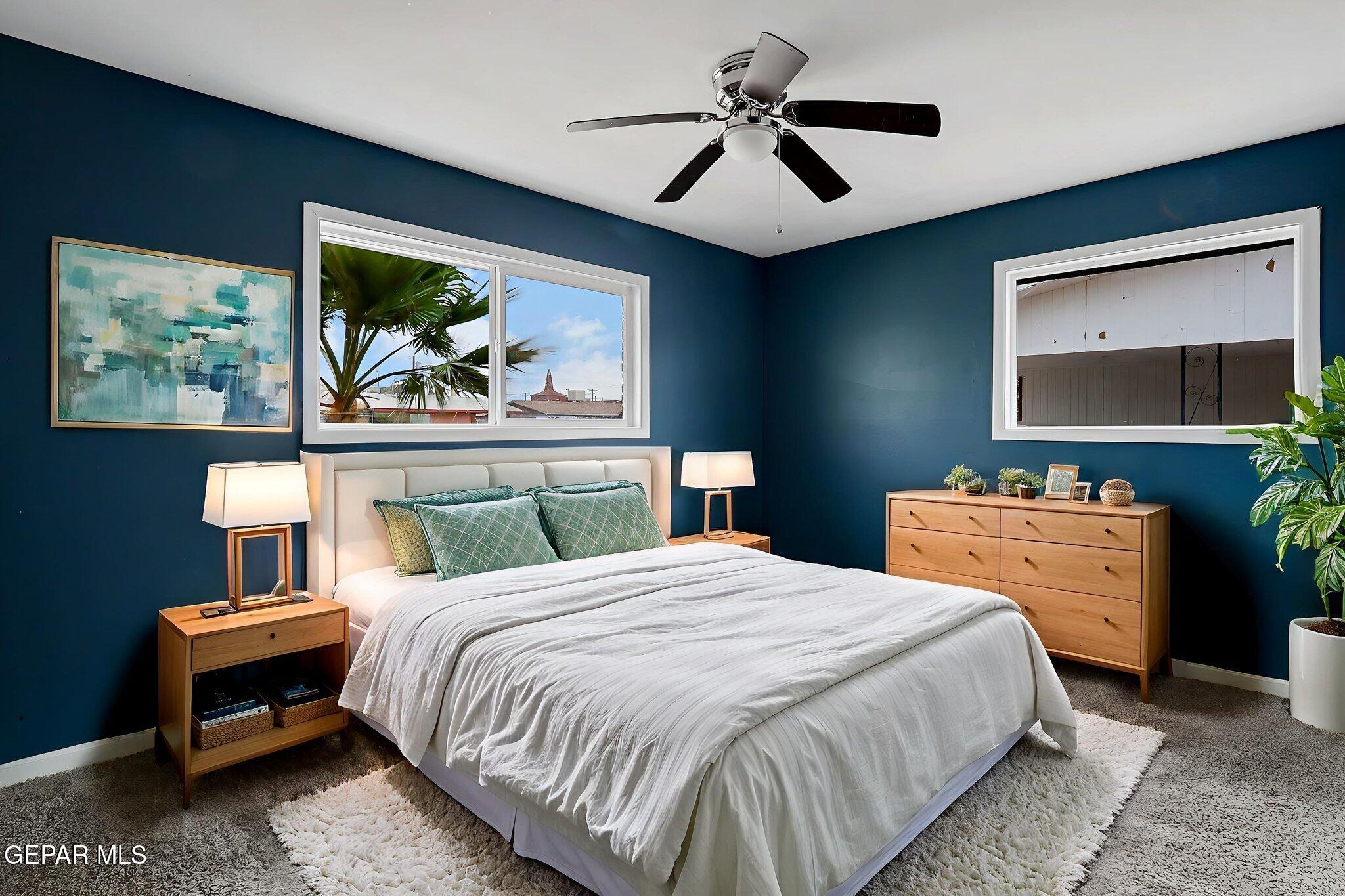 4956 Rutherford Drive El Paso, TX 79924 - Photo 26 of 41 a bedroom with a bed a dresser and painting on the wall