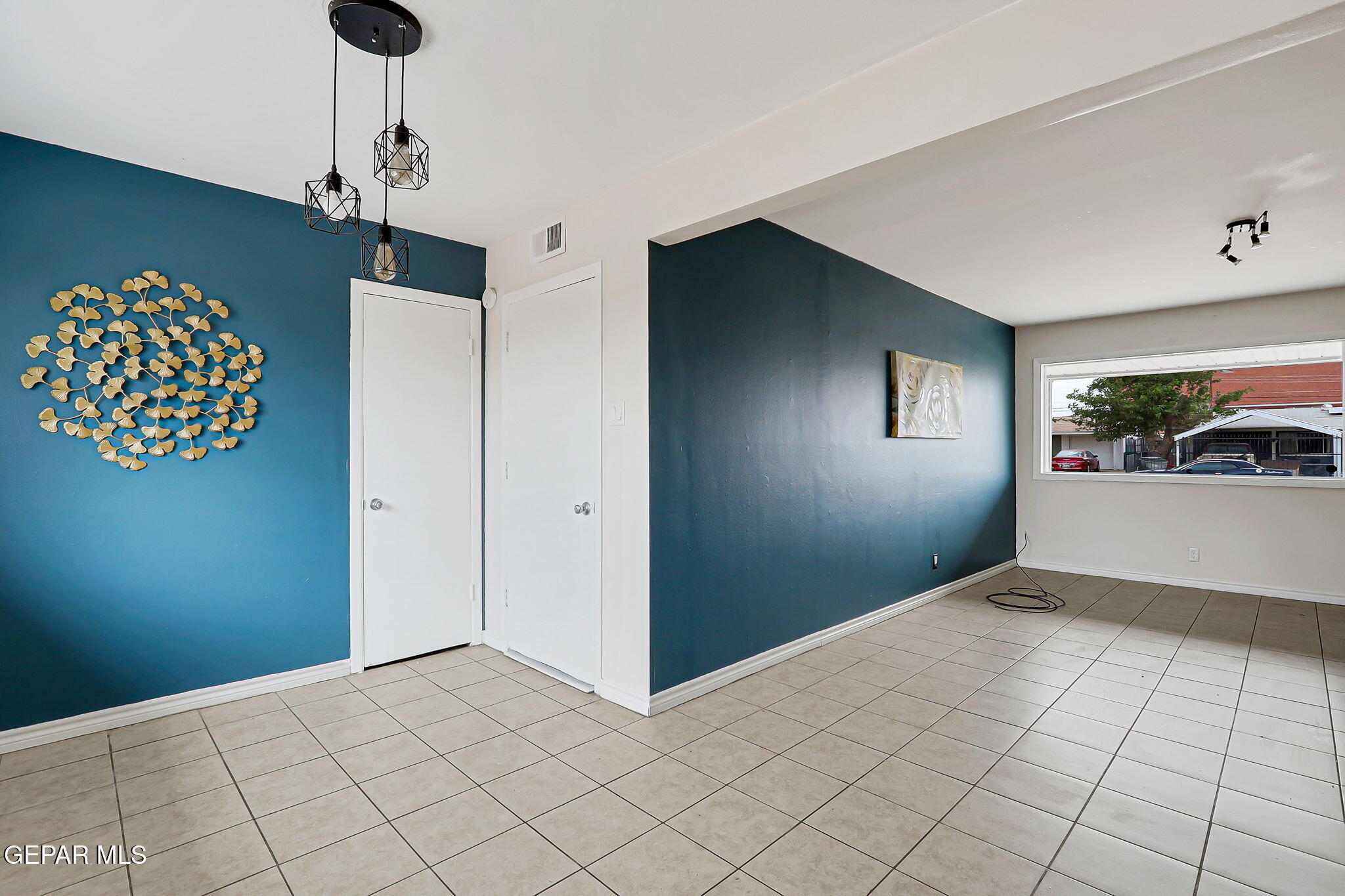 4956 Rutherford Drive El Paso, TX 79924 - Photo 7 of 41 a view of an empty room with window and chandelier fan