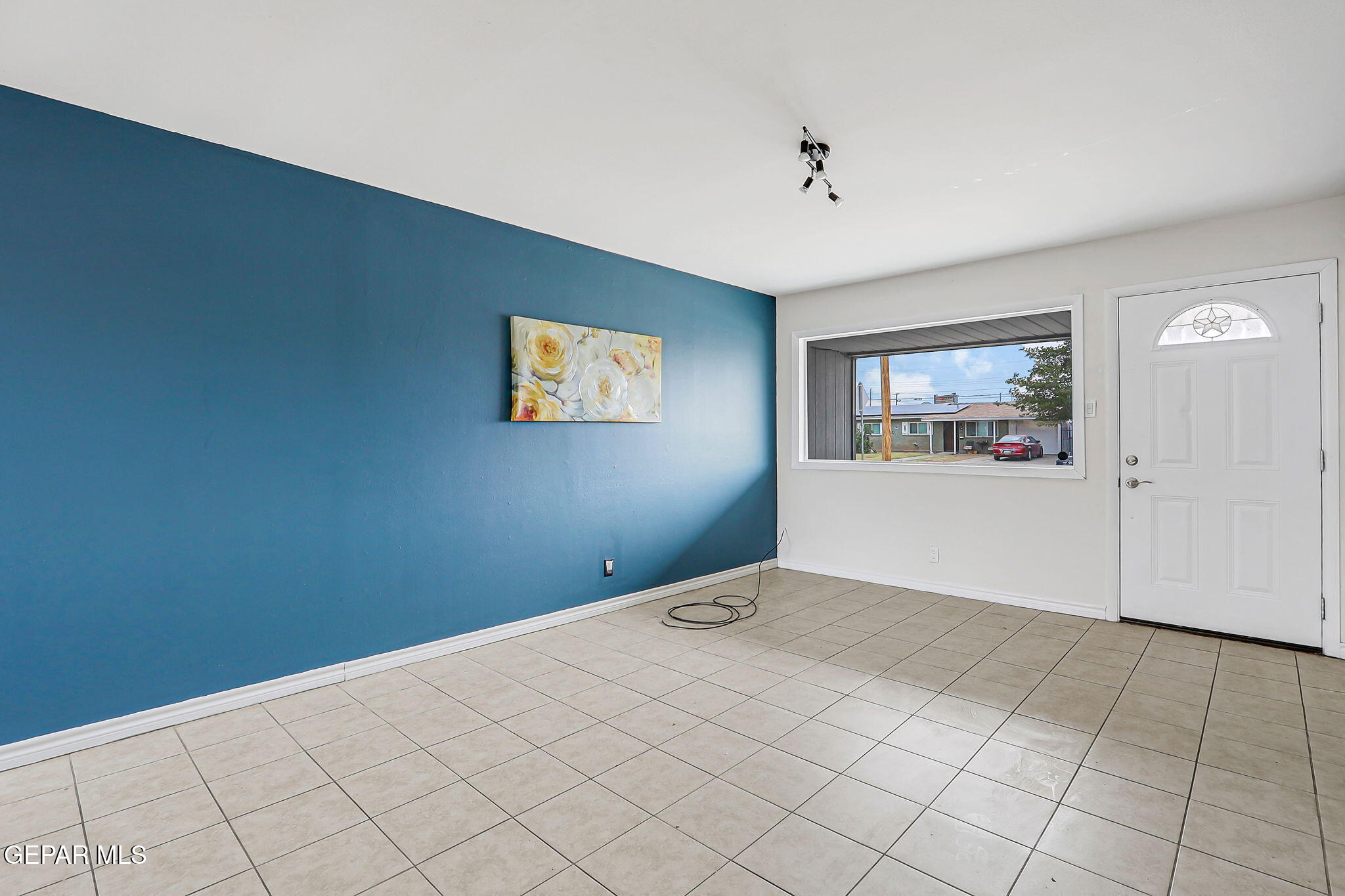4956 Rutherford Drive El Paso, TX 79924 - Photo 8 of 41 a view of a livingroom with wooden floor and cabinet
