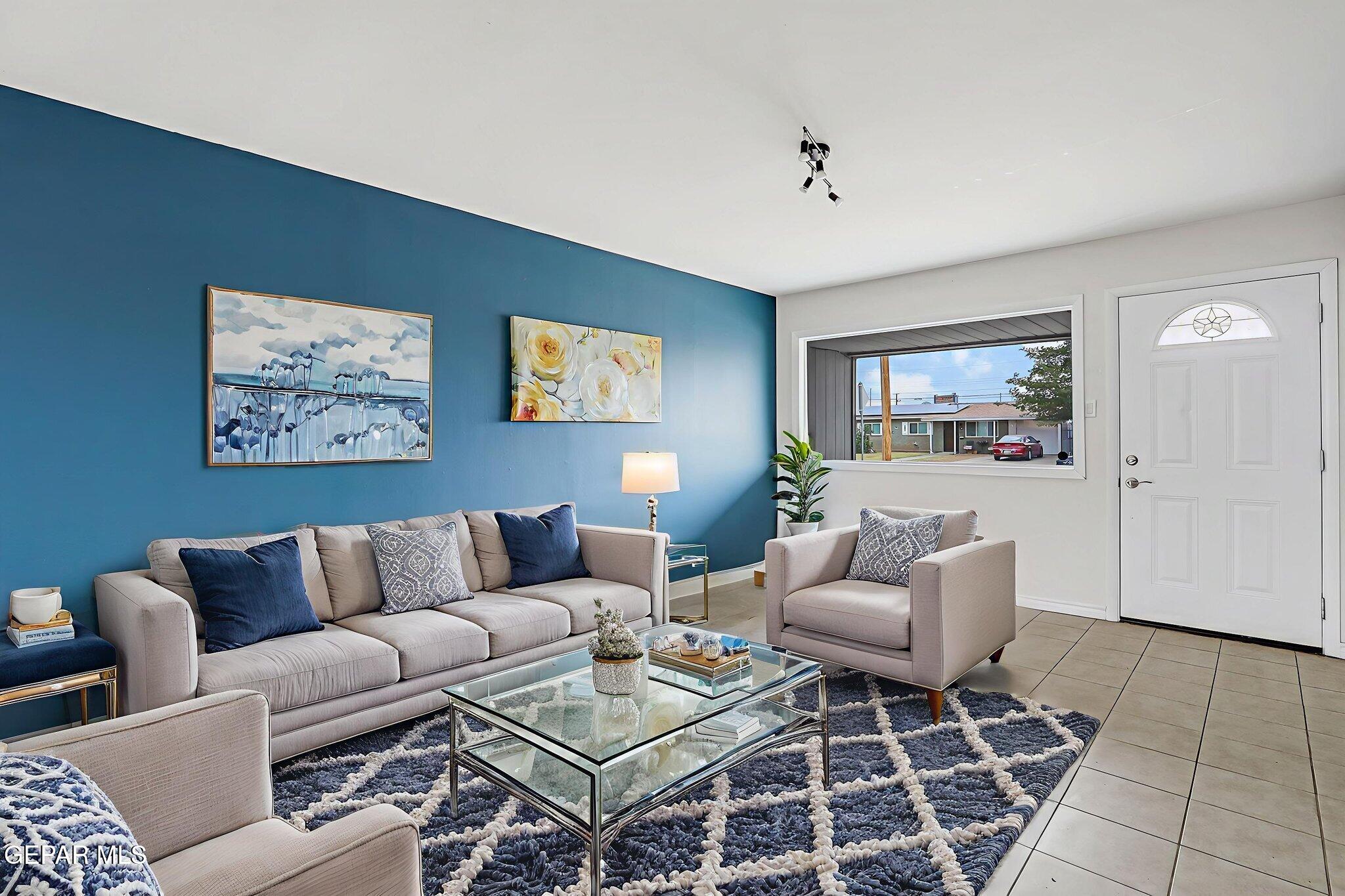 4956 Rutherford Drive El Paso, TX 79924 - Photo 9 of 41 a living room with furniture and a rug