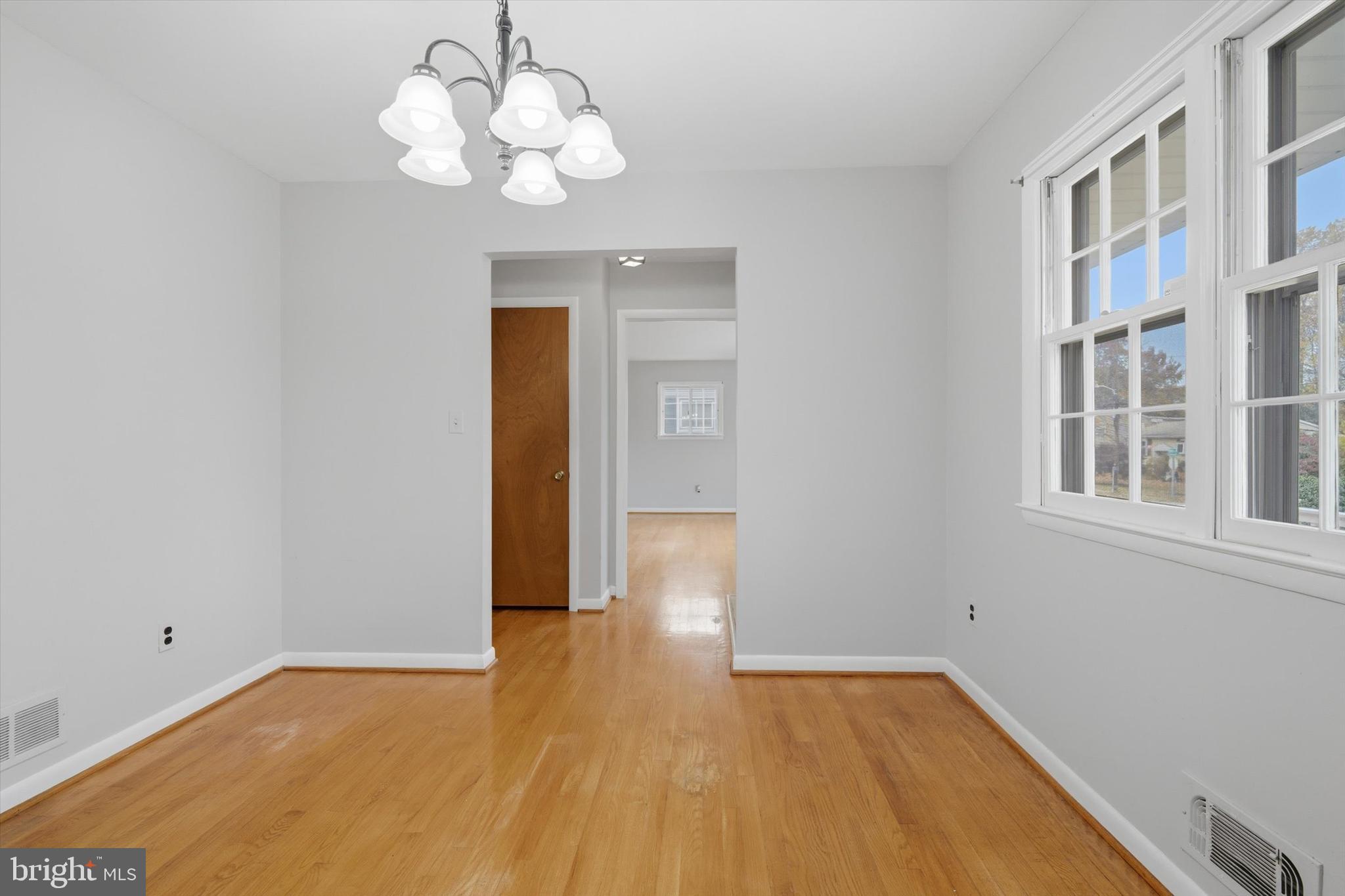 697 West Maple Road Linthicum Heights, MD 21090 - Photo 12 of 36 a view of an empty room with wooden floor