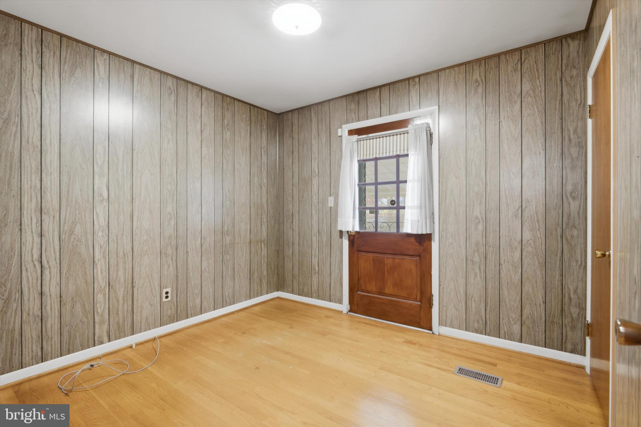697 West Maple Road Linthicum Heights, MD 21090 - Photo 22 of 36 a view of an empty room and a window