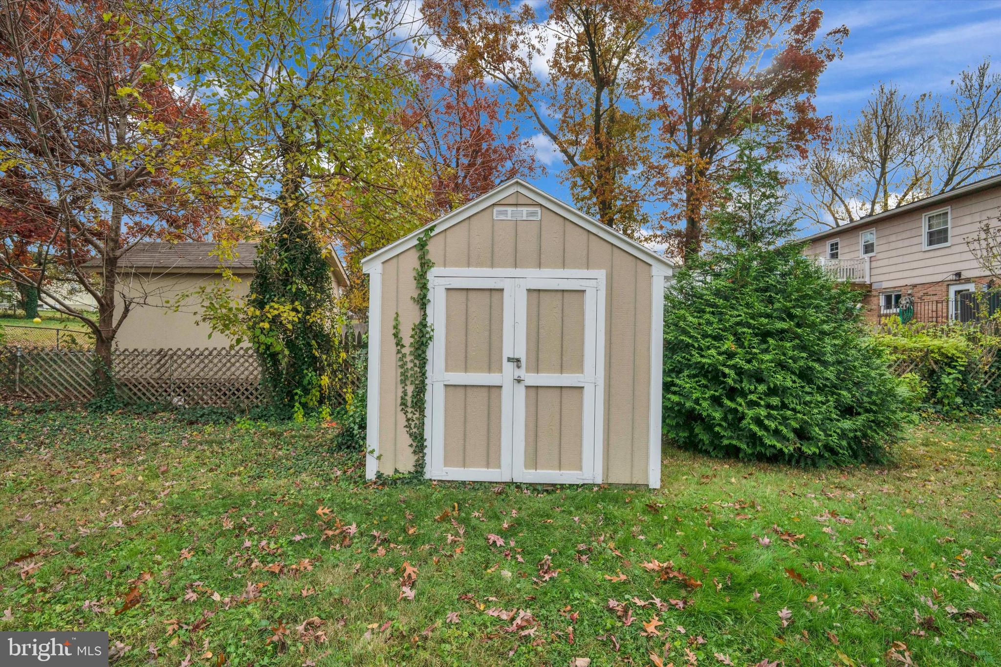 697 West Maple Road Linthicum Heights, MD 21090 - Photo 34 of 36 a front view of a house with a yard and trees