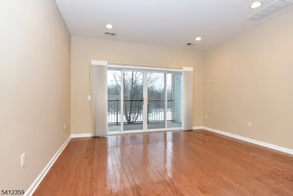 a view of kitchen with furniture and wooden floor