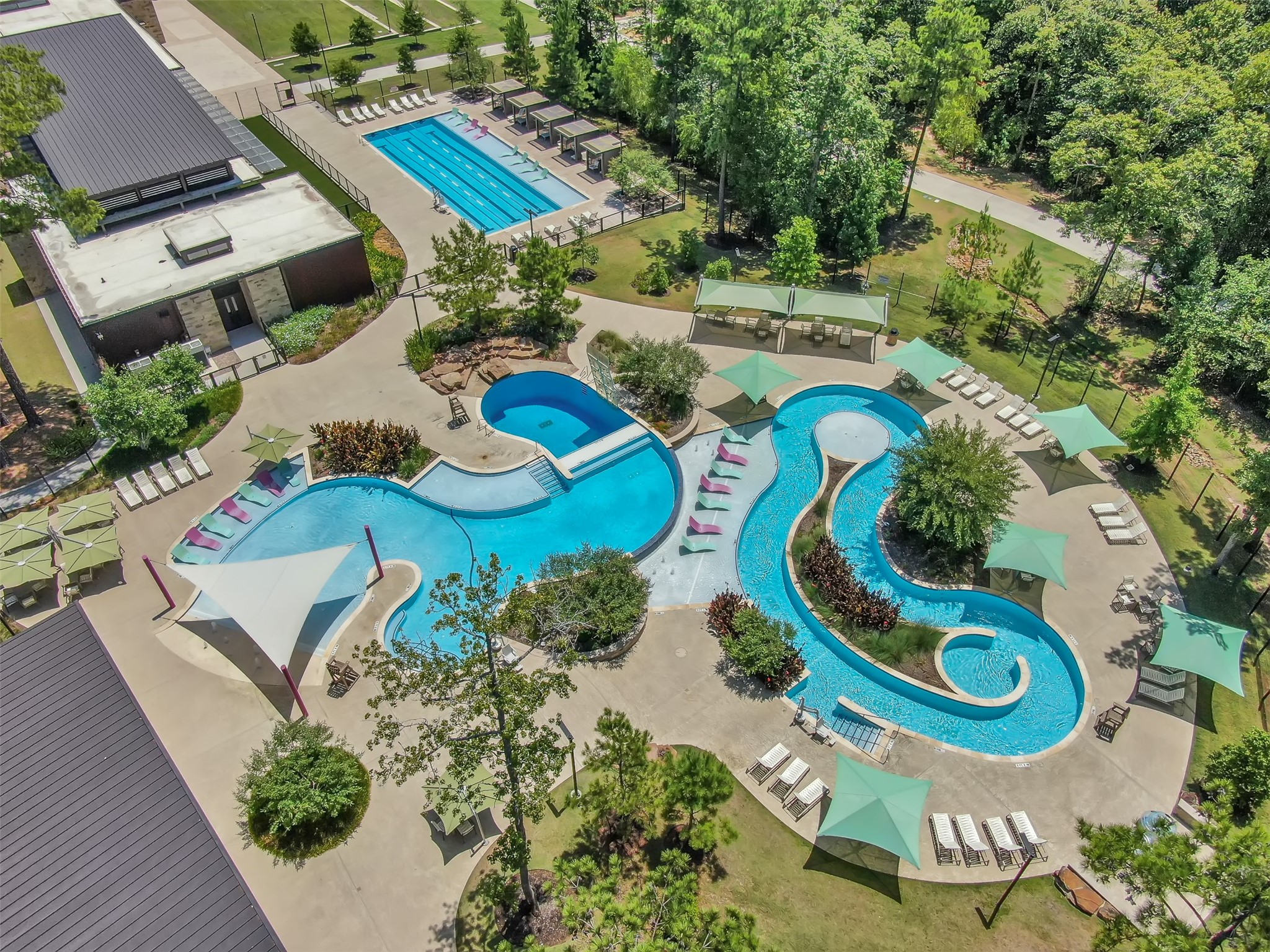 359 Calmato Woods Way Conroe, TX 77318 - Photo 18 of 28 Resort-style community pool with multiple seating areas.