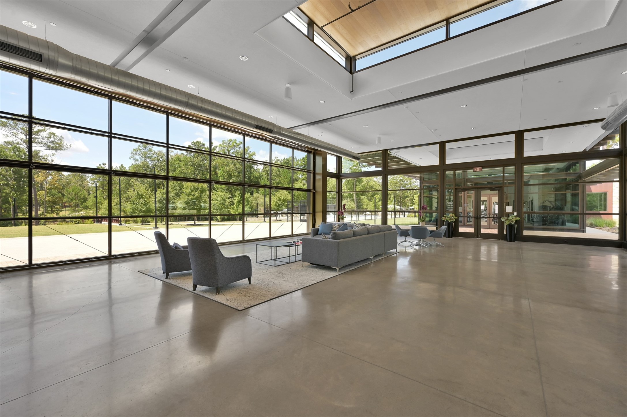 359 Calmato Woods Way Conroe, TX 77318 - Photo 27 of 28 Additional view of the community event center with glass walls that open to the adjacent lawn.