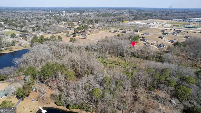 an aerial view of beach and residential space