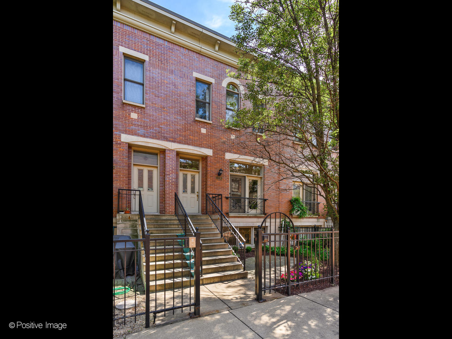 1215 West Lexington Street, Unit E Chicago, IL 60607 - Photo 1 of 21 a front view of a house with a glass door
