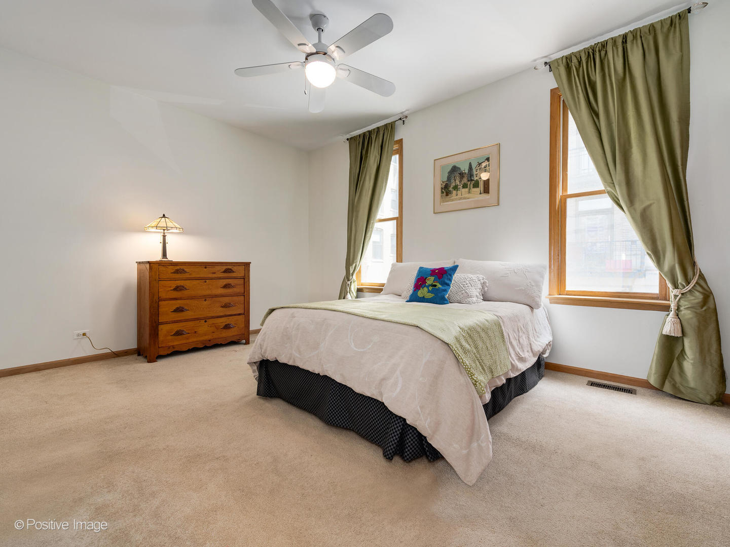 1215 West Lexington Street, Unit E Chicago, IL 60607 - Photo 13 of 21 a spacious bedroom with a bed a dresser and a window