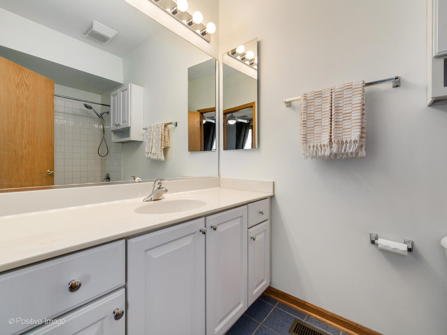 1215 West Lexington Street, Unit E Chicago, IL 60607 - Photo 14 of 21 a bathroom with a sink and a mirror
