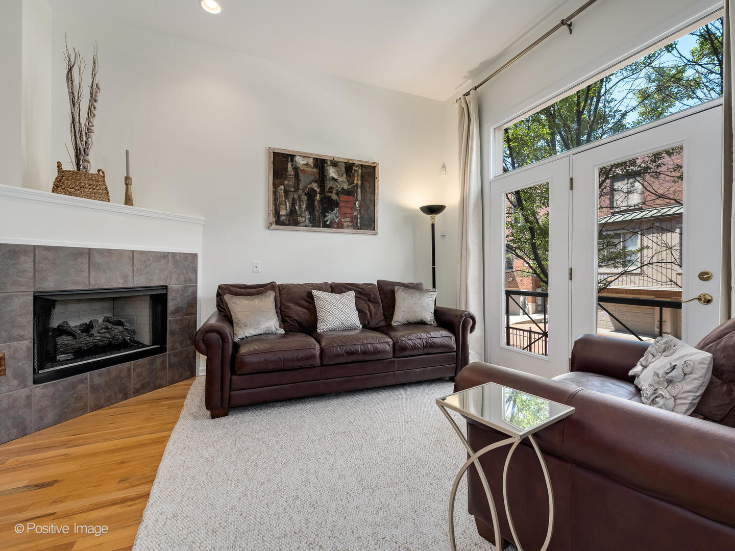 1215 West Lexington Street, Unit E Chicago, IL 60607 - Photo 3 of 21 a living room with furniture and a fireplace