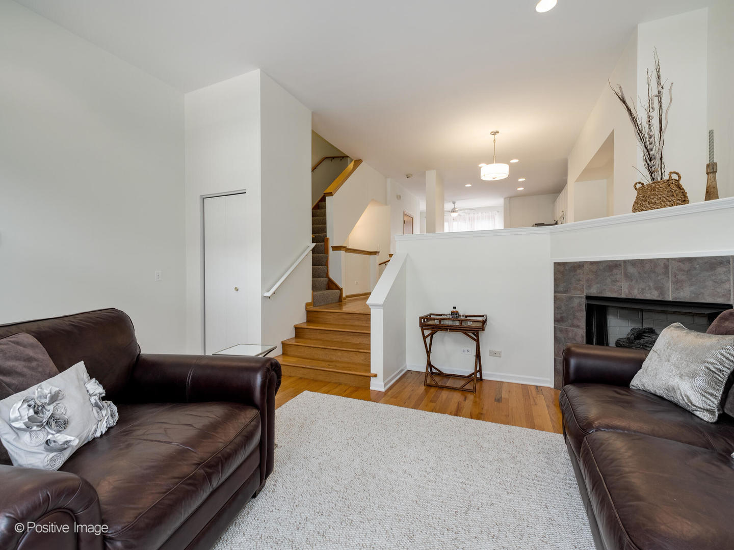 1215 West Lexington Street, Unit E Chicago, IL 60607 - Photo 4 of 21 a living room with furniture and a fireplace