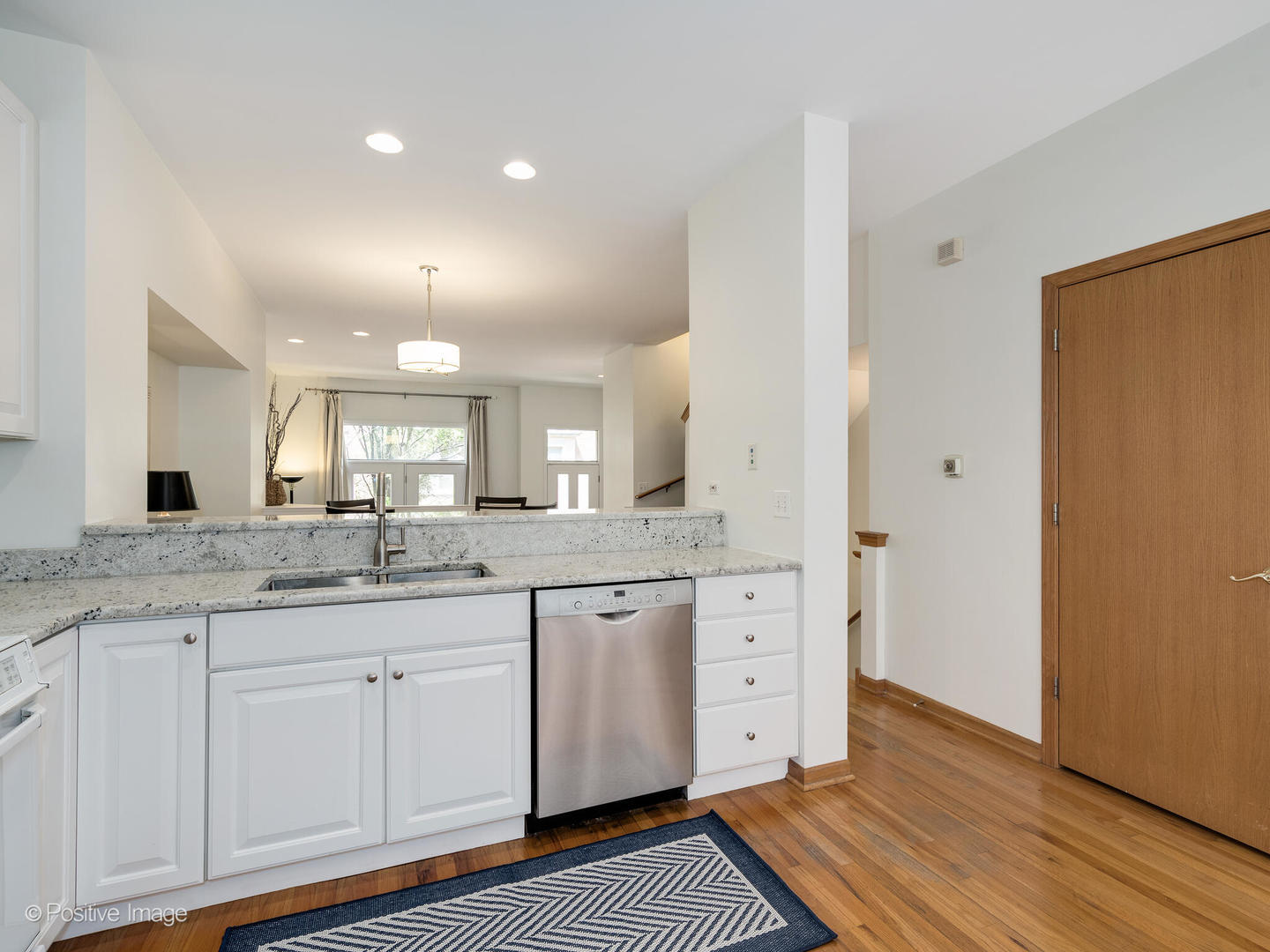 1215 West Lexington Street, Unit E Chicago, IL 60607 - Photo 9 of 21 a bathroom with a granite countertop sink and a mirror