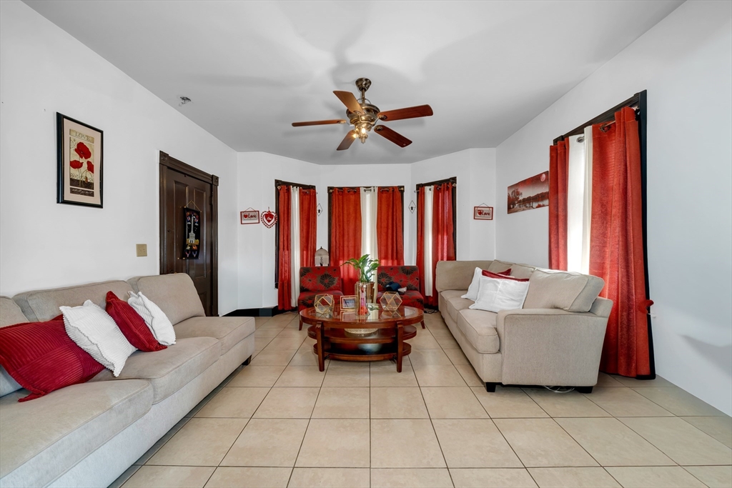 103 Ash Street Nashua, NH 03060 - Photo 15 of 36 a living room with furniture and a large window