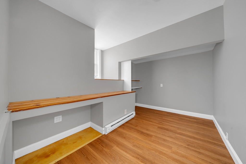 103 Ash Street Nashua, NH 03060 - Photo 19 of 36 a view of empty room with wooden floor