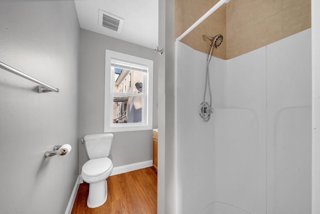 103 Ash Street Nashua, NH 03060 - Photo 22 of 36 a bathroom with a toilet sink and shower