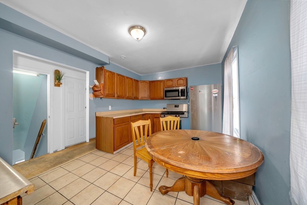 103 Ash Street Nashua, NH 03060 - Photo 24 of 36 a view of a kitchen with appliances and cabinets