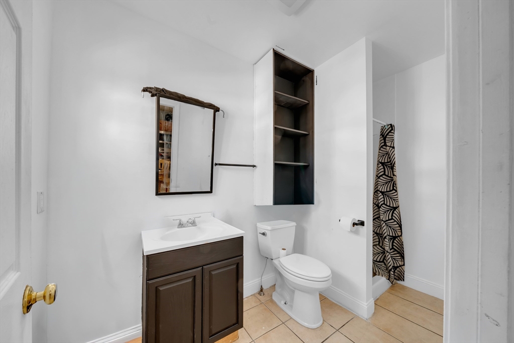 103 Ash Street Nashua, NH 03060 - Photo 25 of 36 a bathroom with a sink toilet and shower