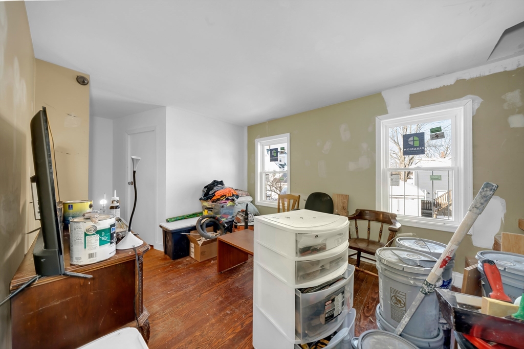 103 Ash Street Nashua, NH 03060 - Photo 26 of 36 a living room with furniture a flat screen tv and a window