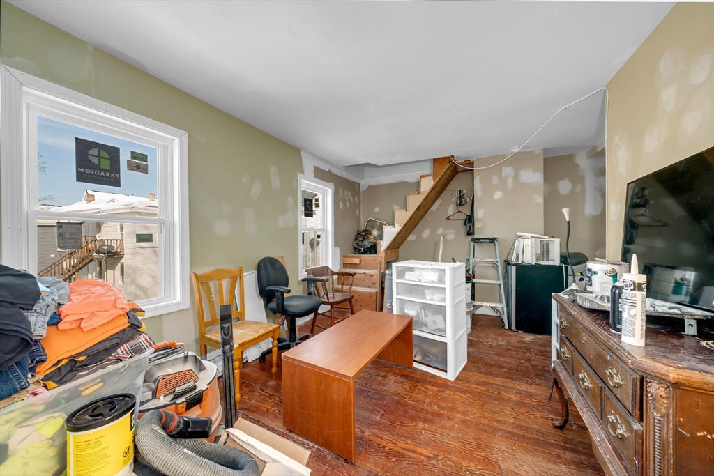 103 Ash Street Nashua, NH 03060 - Photo 27 of 36 a bed room with furniture and a flat screen tv