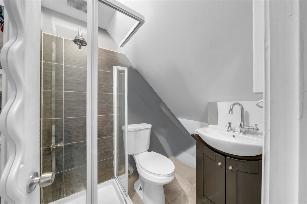 103 Ash Street Nashua, NH 03060 - Photo 30 of 36 a bathroom with a sink toilet and shower