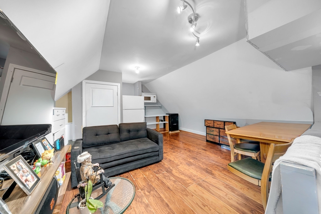 103 Ash Street Nashua, NH 03060 - Photo 31 of 36 a living room with furniture and a wooden floor