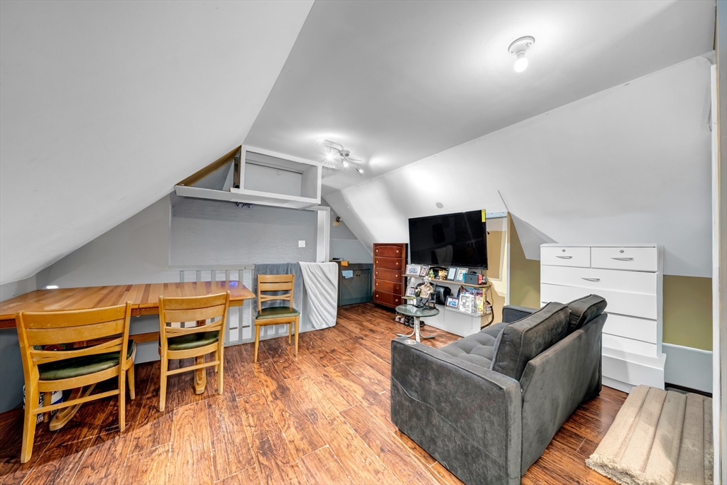 103 Ash Street Nashua, NH 03060 - Photo 32 of 36 a living room with furniture and a flat screen tv