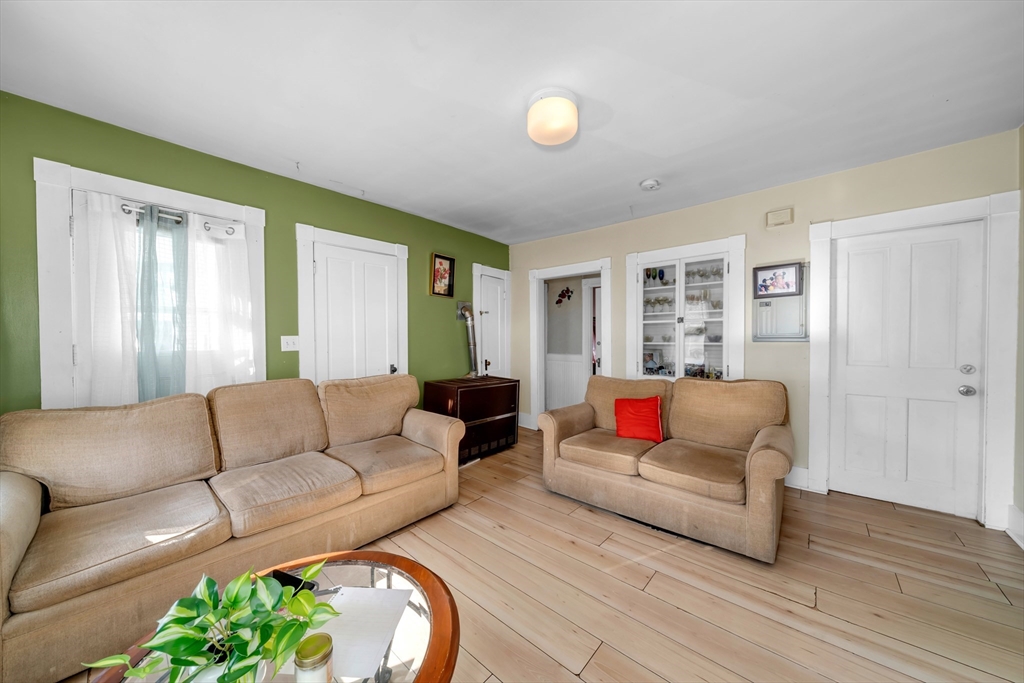 103 Ash Street Nashua, NH 03060 - Photo 4 of 36 a living room with furniture and a couch