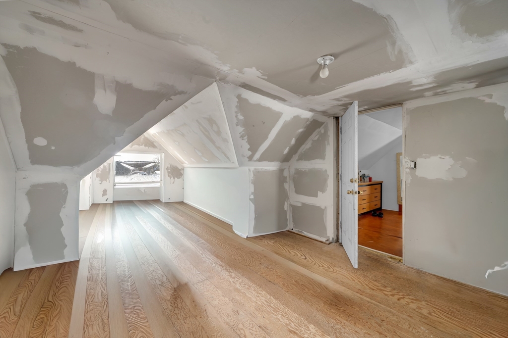 103 Ash Street Nashua, NH 03060 - Photo 8 of 36 a view of entryway and hall with wooden floor