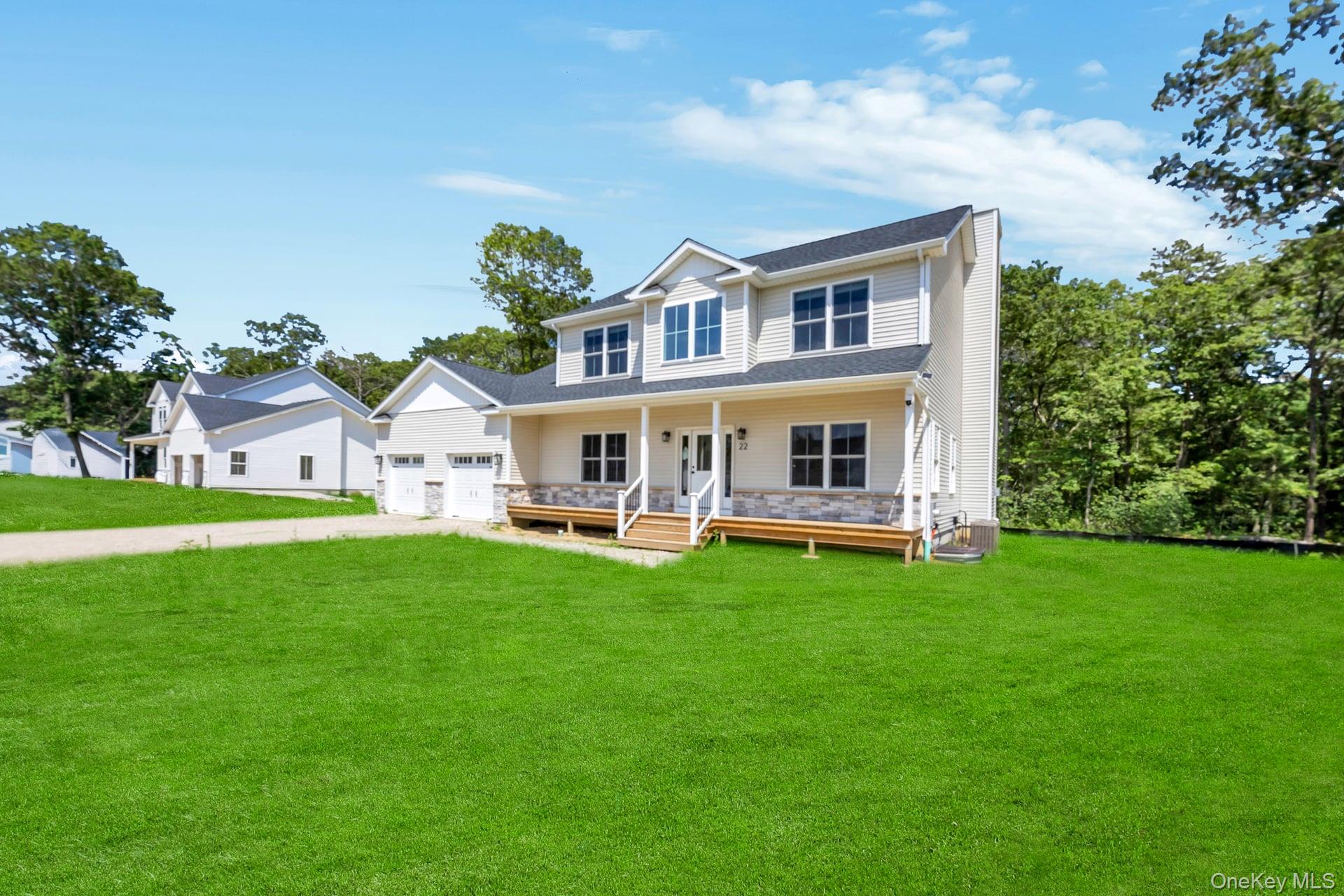 Lot #36 Fox Run Court Ridge, NY 11961 - Photo 15 of 17 a view of an house with backyard space and sitting area