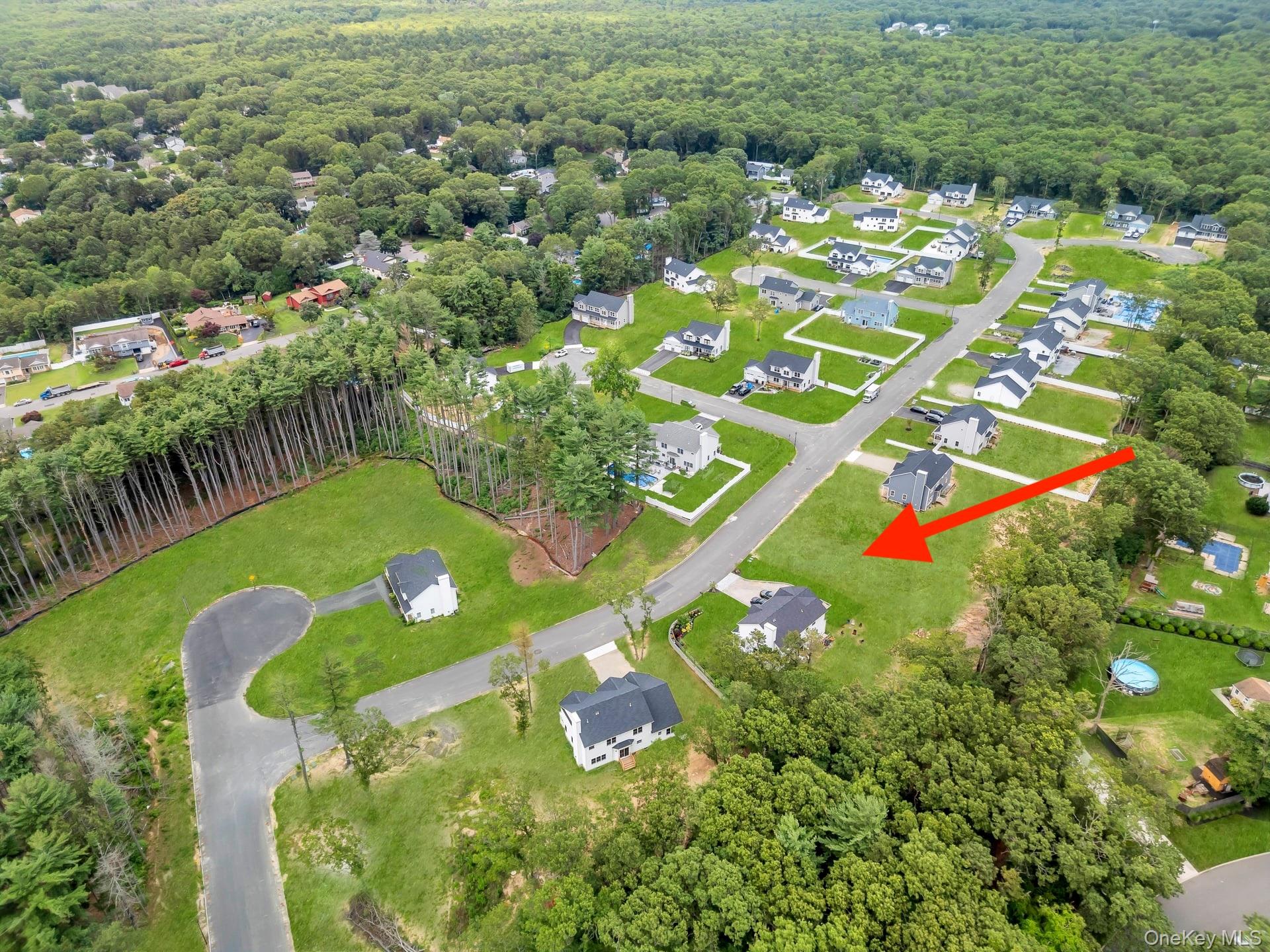 Lot #36 Fox Run Court Ridge, NY 11961 - Photo 3 of 17 a view of a multi story residential apartment building