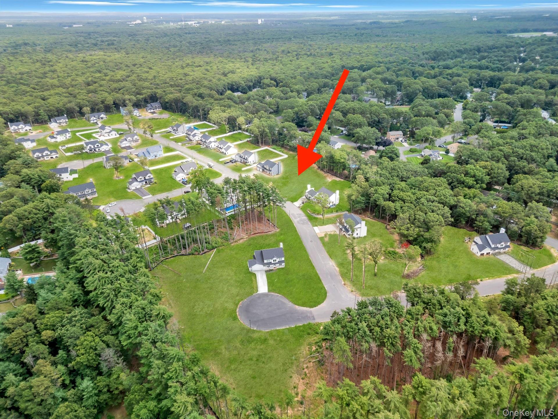 Lot #36 Fox Run Court Ridge, NY 11961 - Photo 5 of 17 a view of a lake with a mountain