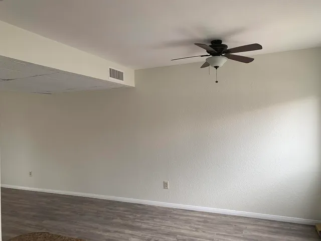 a view of a big room with wooden floor