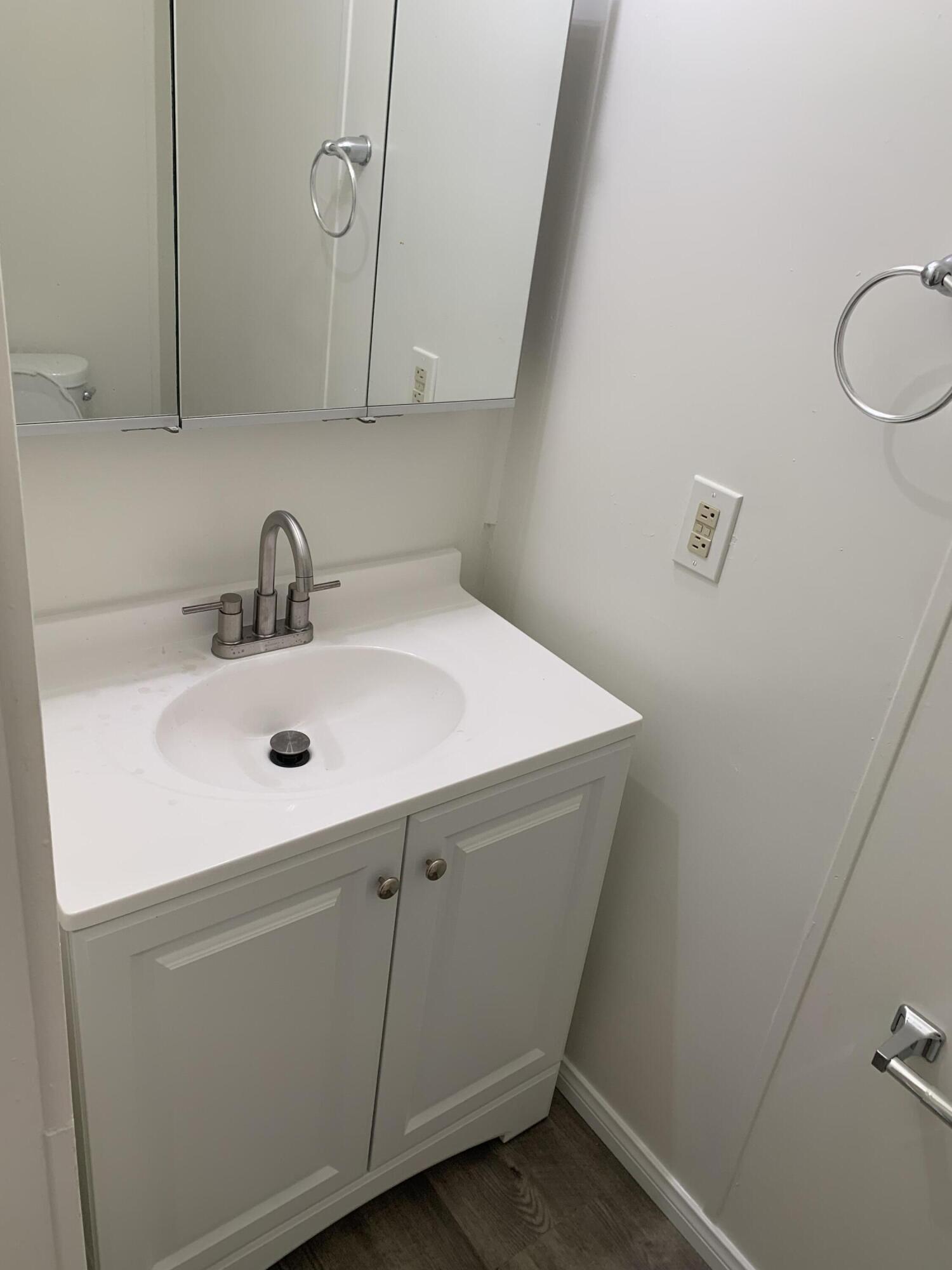 40225 Harris Lane, Unit 304 Palm Desert, CA 92211 - Photo 5 of 14 a bathroom with a sink and a toilet