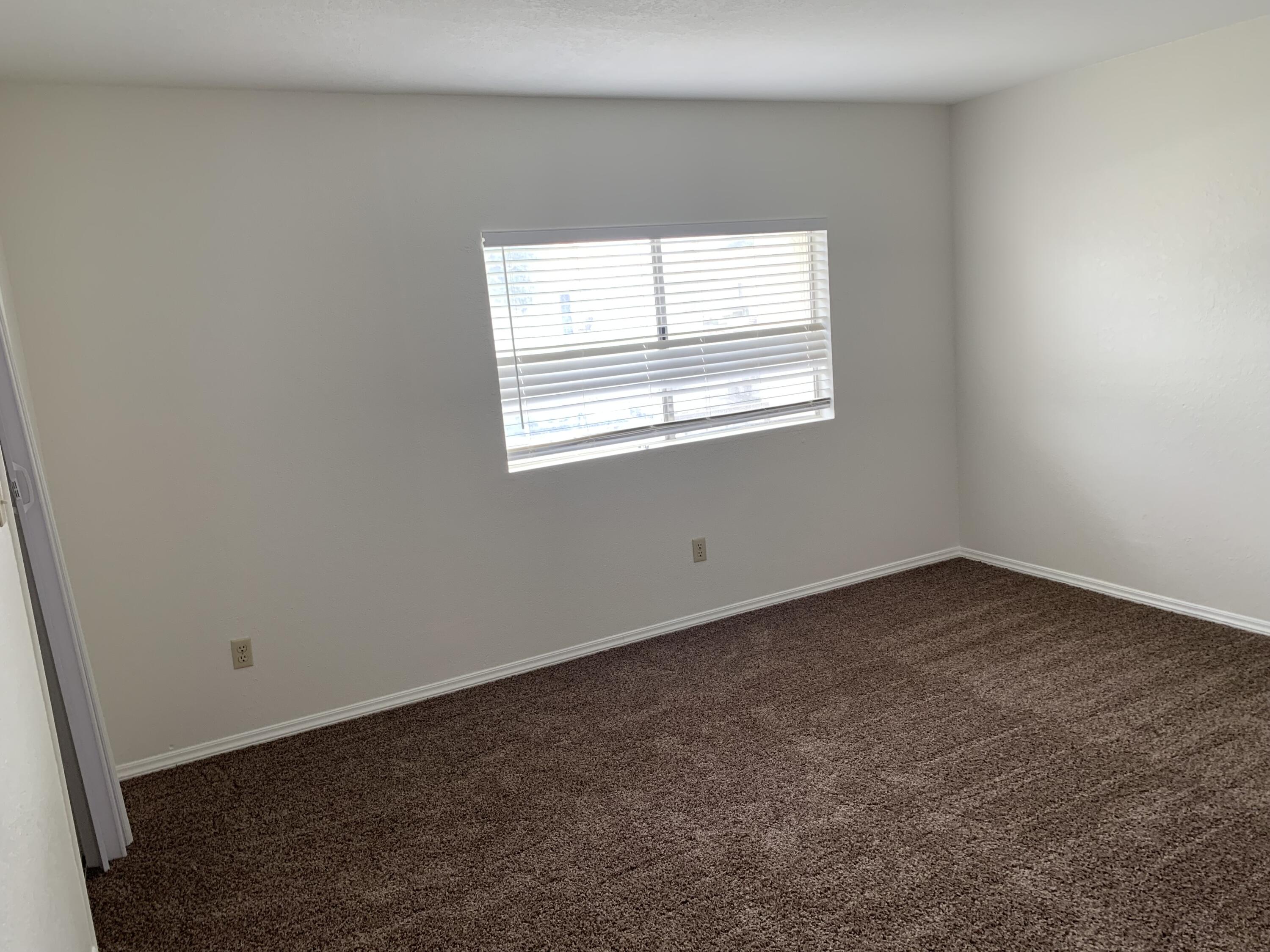 40225 Harris Lane, Unit 304 Palm Desert, CA 92211 - Photo 9 of 14 an empty room with a window