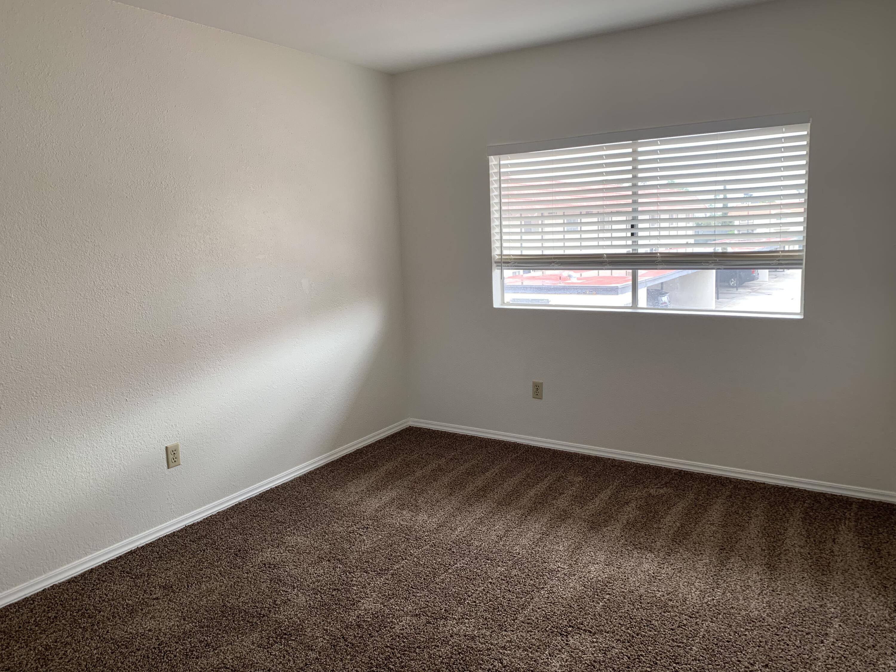 40225 Harris Lane, Unit 304 Palm Desert, CA 92211 - Photo 10 of 14 an empty room with a window