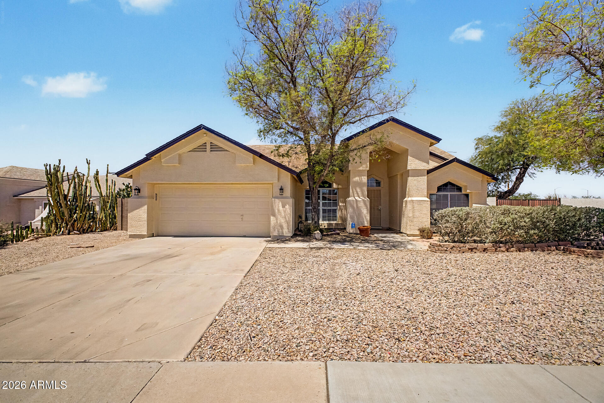 2762 North Ricardo Mesa, AZ 85215 - Photo 3 of 38 a front view of a house with a yard and garage