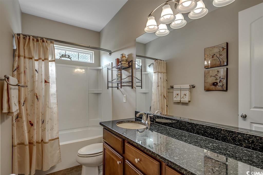 8472 Juxa Drive Myrtle Beach, SC 29579 - Photo 13 of 35 Full bathroom featuring vanity, shower / tub combo, and a chandelier