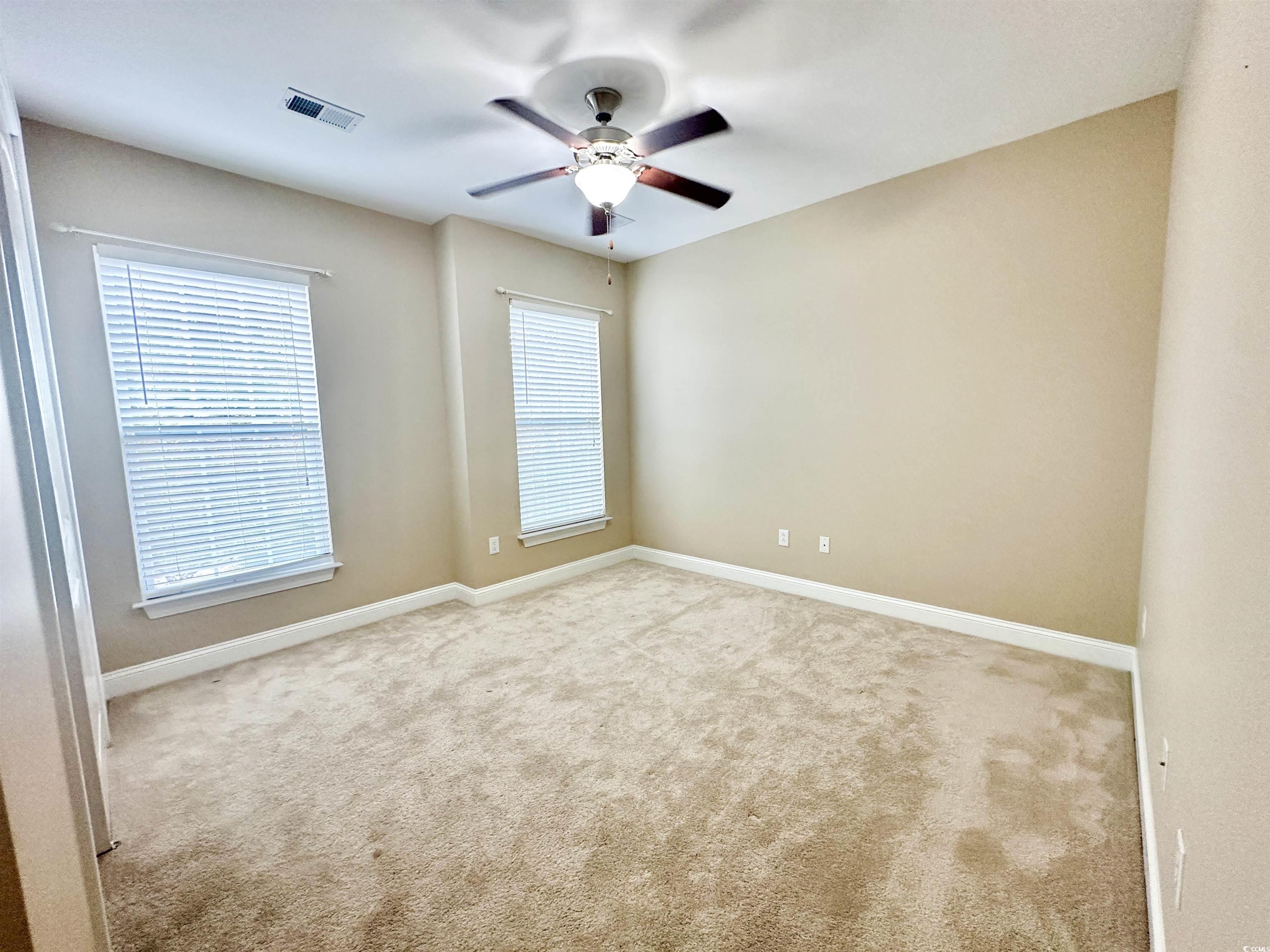 8472 Juxa Drive Myrtle Beach, SC 29579 - Photo 16 of 35 Spare room featuring carpet and ceiling fan