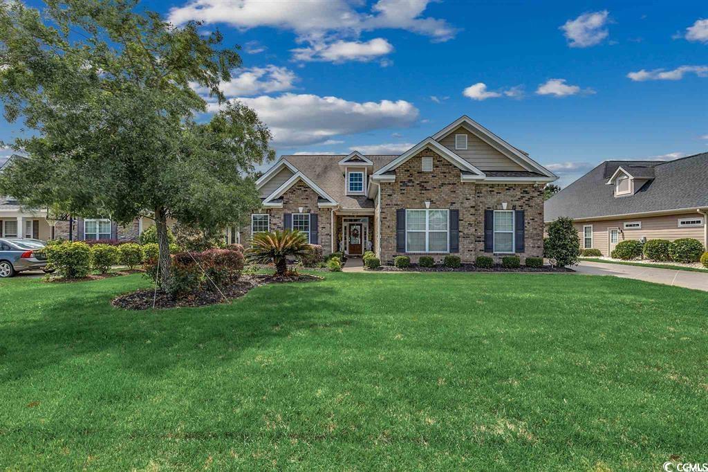 8472 Juxa Drive Myrtle Beach, SC 29579 - Photo 2 of 35 Craftsman house featuring a front yard and brick siding