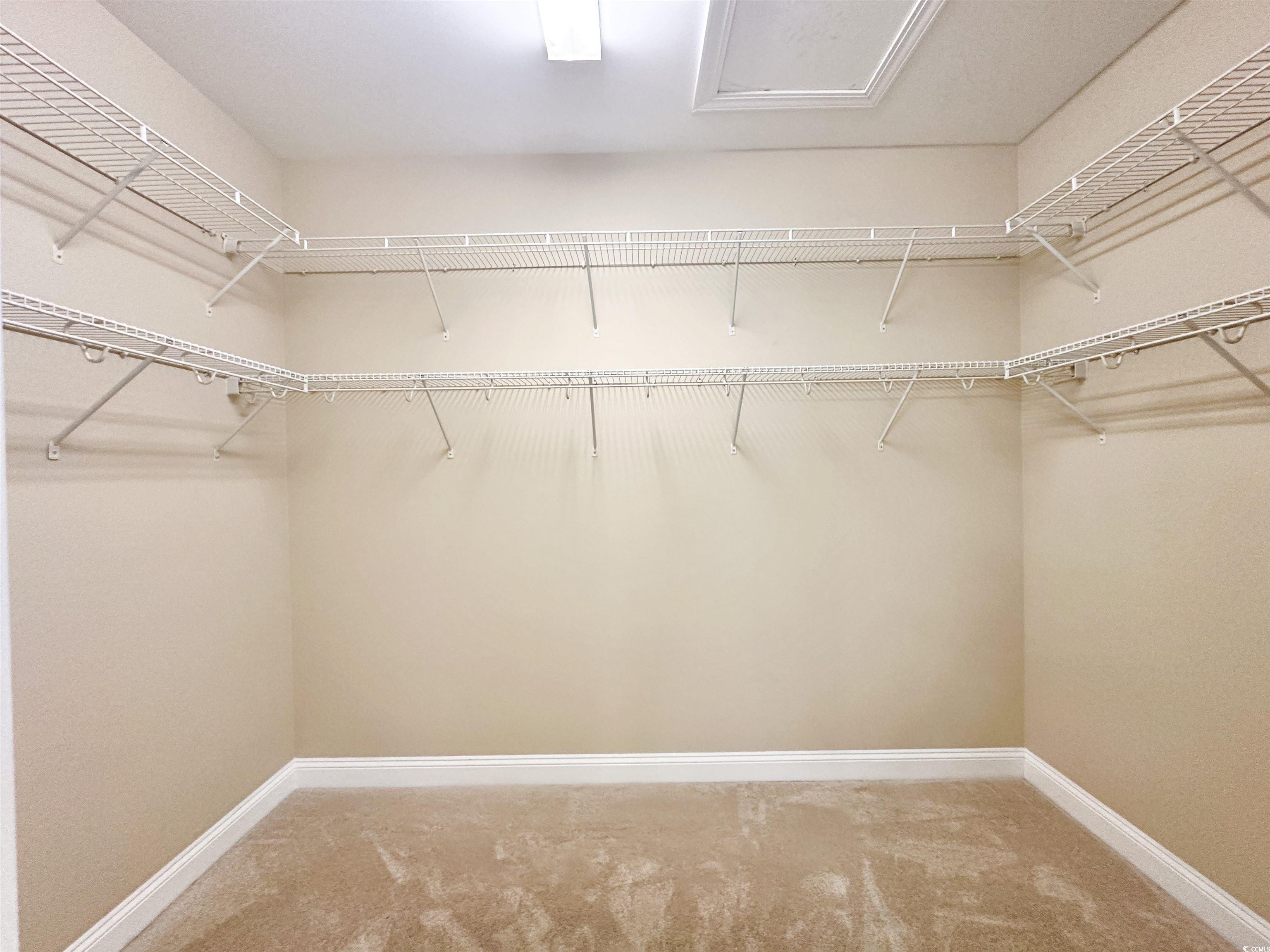 8472 Juxa Drive Myrtle Beach, SC 29579 - Photo 22 of 35 Spacious closet with light colored carpet