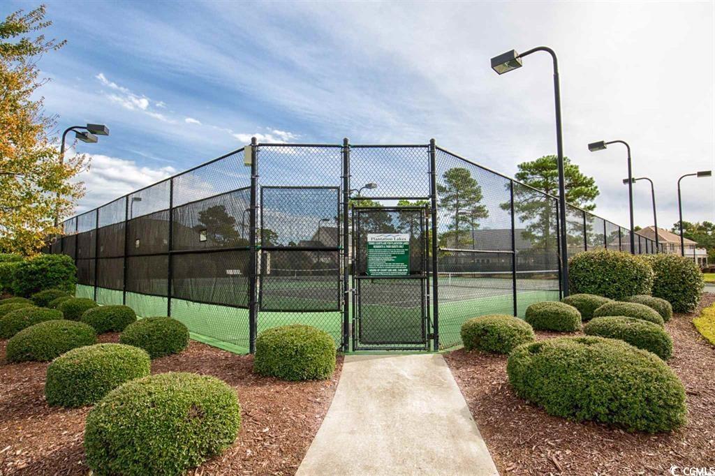 8472 Juxa Drive Myrtle Beach, SC 29579 - Photo 33 of 35 View of tennis court with a gate